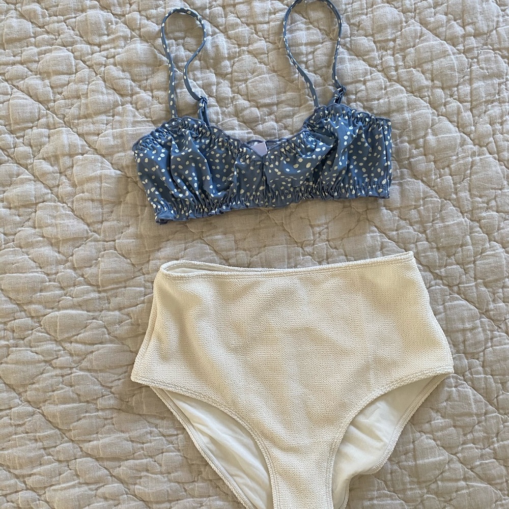 Blue polka dot bikini top and white bottoms